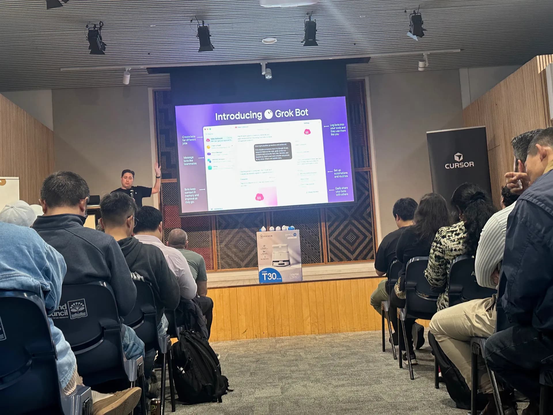 Side view of the audience during the Grok Bot introduction
