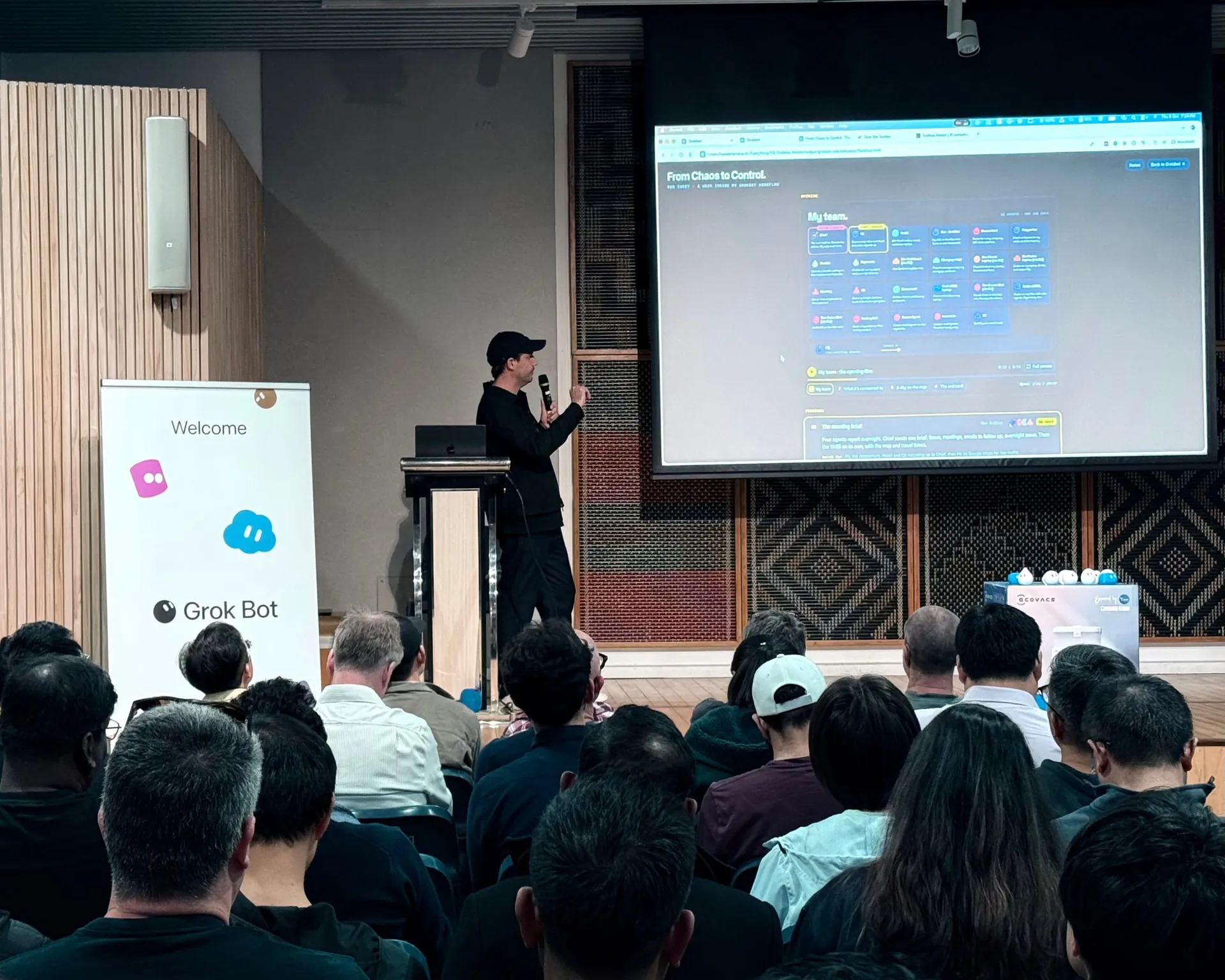 Speaker presenting a dashboard grid to the audience
