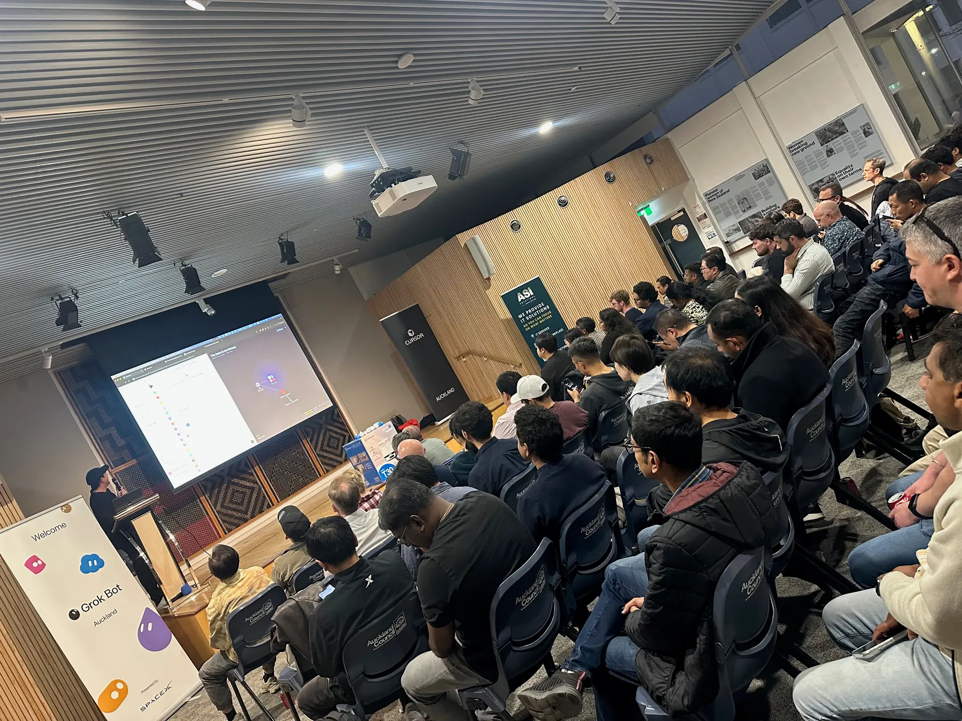 Attendees seated in rows during the evening's talks