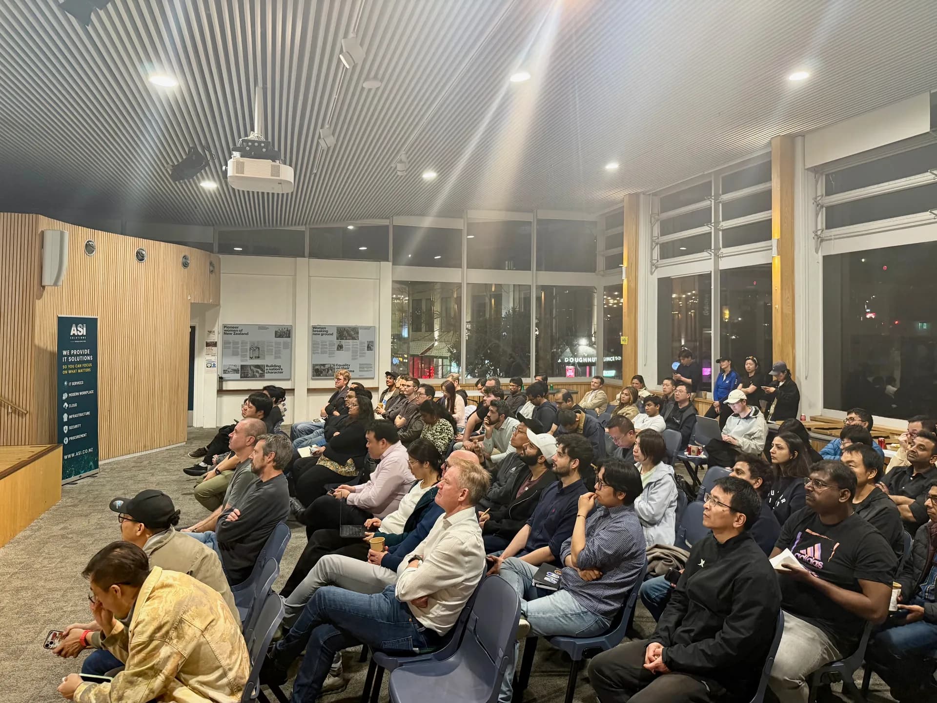 Side view of the packed hall during the final talk