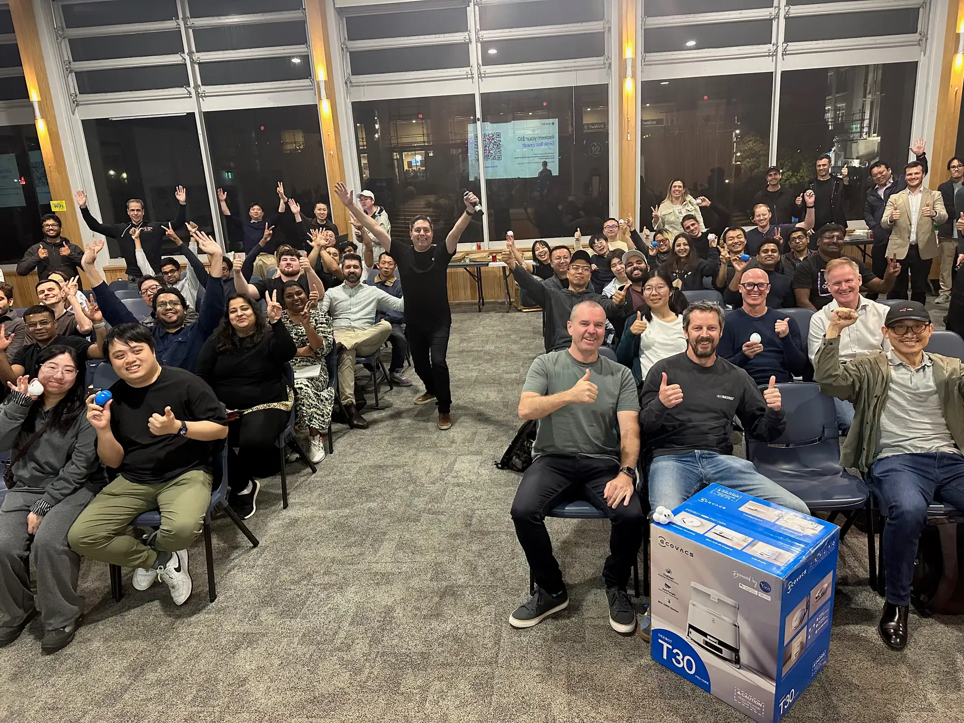 Attendees cheering in the end-of-night group photo