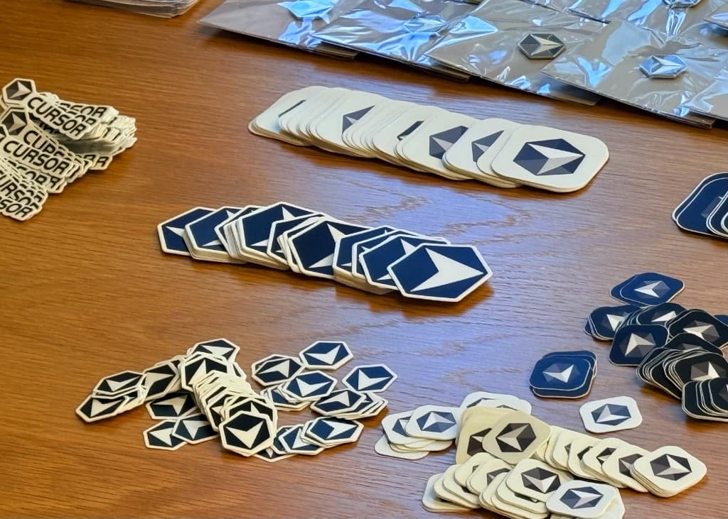 Cursor community stickers and pins at Christchurch Meetup #1